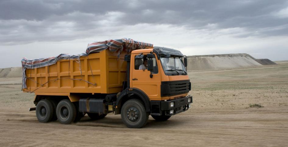 A truck drives away from a mine.