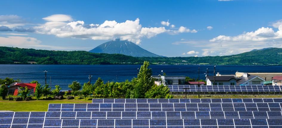 solar panles in japan, mountain in the background