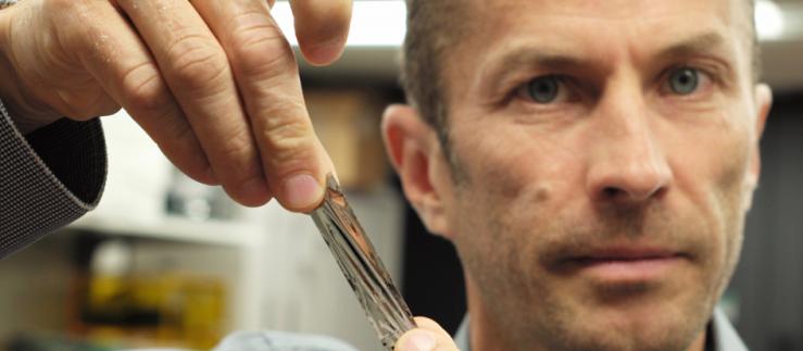 IBM scientist Mark Lantz holds a piece of magnetic tape.