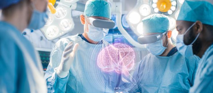Human brain hologram surrounded by doctors