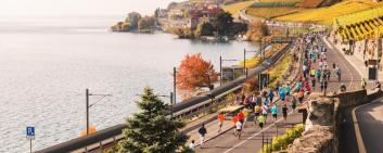 Runners in the Lausanne Marathon going through Lavaux vineyards on Swiss riviera