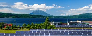 solar panles in japan, mountain in the background